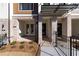 Inviting brick front porch with decorative columns and wrought iron fencing at 352 Olmstead Way # 28, Alpharetta, GA 30022