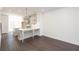 Bright, modern kitchen features white cabinets, quartz countertops and an island with counter seating at 352 Olmstead Way # 28, Alpharetta, GA 30022