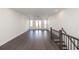 Bright living room with hardwood floors, recessed lighting, and access to an outdoor deck through glass doors at 352 Olmstead Way # 28, Alpharetta, GA 30022