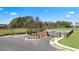 Alternate view of Shoal Creek community entrance with brick pillars and black metal gates at 12014 Conrad Cir, Hampton, GA 30228