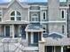 Inviting townhome featuring a modern gray facade, prominent windows, and a welcoming front entrance at 14 Saint Claire Ne Ln, Atlanta, GA 30324