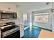 Kitchen with stainless appliances and door leading to the outside at 14 Saint Claire Ne Ln, Atlanta, GA 30324