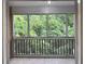 Enclosed porch with great scenic views of green forest canopy at 14 Saint Claire Ne Ln, Atlanta, GA 30324