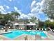 Community pool area with ample seating surrounded by landscaped grounds at 14 Saint Claire Ne Ln, Atlanta, GA 30324