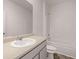 Bright bathroom featuring a large mirror, neutral countertop, and a tub-shower combination at 8588 Seabiscuit Rd, Lithonia, GA 30058