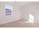 Bright bedroom with neutral carpeting and a window view at 8588 Seabiscuit Rd, Lithonia, GA 30058