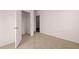 Bedroom with an open closet and neutral carpeting at 8588 Seabiscuit Rd, Lithonia, GA 30058