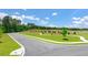 Picturesque street view showcasing lush greenery, a well-maintained road, and a beautiful, sunny atmosphere at 8588 Seabiscuit Rd, Lithonia, GA 30058