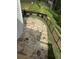 Outdoor stone patio with built-in fire pit and a wrought-iron fence along the perimeter, ideal for entertaining at 1065 Low Water Nw Xing, Acworth, GA 30101