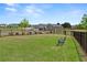Community dog park features a fenced area with green grass and a bench at 5365 Maggie Mae Ln, Cumming, GA 30028