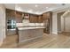 Bright kitchen with stainless steel appliances, island, and custom cabinetry at 5365 Maggie Mae Ln, Cumming, GA 30028