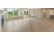 Bright living room with large windows and glass doors leading to the outdoor space at 5365 Maggie Mae Ln, Cumming, GA 30028