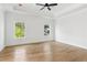 Bright bedroom features a tray ceiling and large windows at 104 Cottage Gate Ln, Roswell, GA 30076
