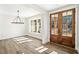 Bright dining room features hardwood floors and a chandelier at 303 Evie Ln, Canton, GA 30115