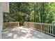 Spacious wooden deck overlooking a wooded area at 4166 Riverhill Ne Ct, Roswell, GA 30075