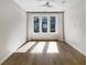 Bright bedroom with hardwood floors, modern lighting, and large windows for natural light at 371 Pratt Se Dr # 203, Atlanta, GA 30315