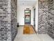 Front entry of townhome with brick columns and a stylish exterior door at 371 Pratt Se Dr # 203, Atlanta, GA 30315