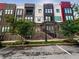 Modern townhome exterior with brick accents, multiple stories, and a well-maintained lawn at 371 Pratt Se Dr # 203, Atlanta, GA 30315