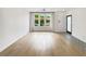 Bright living room with hardwood floors, modern lighting, and large windows for natural light at 371 Pratt Se Dr # 203, Atlanta, GA 30315