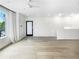 Open living area with hard wood floors, modern fan, large windows and a sleek design at 371 Pratt Se Dr # 203, Atlanta, GA 30315