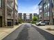 Street view of modern apartment buildings with garages; brick and contemporary exteriors at 371 Pratt Se Dr # 203, Atlanta, GA 30315