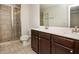 Bathroom with double sink vanity and glass enclosed shower at 2539 Hedgeway Cir, Kennesaw, GA 30144