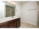 Bathroom featuring a white vanity, tile flooring, and tiled shower at 2539 Hedgeway Cir, Kennesaw, GA 30144