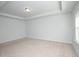 Spacious bedroom with neutral carpet, white walls, and tray ceiling at 2539 Hedgeway Cir, Kennesaw, GA 30144