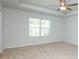 Carpeted bedroom features a ceiling fan and abundant natural light at 2539 Hedgeway Cir, Kennesaw, GA 30144