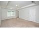 Light-filled bedroom featuring neutral carpet and a double-door closet at 2539 Hedgeway Cir, Kennesaw, GA 30144