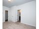Neutral bedroom featuring carpet, white walls, and doors to closet and bathroom at 2539 Hedgeway Cir, Kennesaw, GA 30144