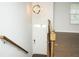 Bright entryway featuring hardwood floors, modern lighting, and a staircase with wood and iron railings at 2539 Hedgeway Cir, Kennesaw, GA 30144
