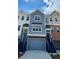 Charming townhome exterior featuring varied textures, private entrances, and attached garages at 2539 Hedgeway Cir, Kennesaw, GA 30144