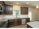 Kitchen showcasing granite countertops, stainless steel appliances, and dark cabinetry at 2539 Hedgeway Cir, Kennesaw, GA 30144