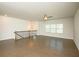 Spacious living room featuring hardwood floors, modern lighting, and large windows for natural light at 2539 Hedgeway Cir, Kennesaw, GA 30144