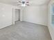 Bright bedroom with ample closet space and neutral carpeting at 7527 Stonebridge Bay Ct, Stone Mountain, GA 30087