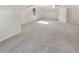 Spacious bonus room with grey carpet and window at 7527 Stonebridge Bay Ct, Stone Mountain, GA 30087