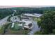 Aerial of community center, playground, parking and wooded area with walking path at 626 Skytop Dr # 159, Cumming, GA 30040