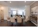 Bright dining area with hardwood floors, a modern table, and a decorative light fixture at 626 Skytop Dr # 159, Cumming, GA 30040