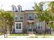 Charming brick townhome with a covered porch, tidy landscaping, and classic design at 626 Skytop Dr # 159, Cumming, GA 30040