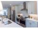 Modern kitchen with stainless steel appliances, sleek countertops, and a stylish backsplash at 626 Skytop Dr # 159, Cumming, GA 30040