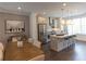 Open concept living space with a dining area, a kitchen, and hardwood flooring throughout at 626 Skytop Dr # 159, Cumming, GA 30040