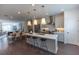 Open floor plan showcasing the kitchen, dining area, and hardwood floors for a spacious feel at 626 Skytop Dr # 159, Cumming, GA 30040