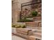 Modern stairway with wood benches and lush landscaping, ideal for relaxing outdoors at 626 Skytop Dr # 159, Cumming, GA 30040