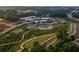 Aerial view of a commercial district with lush trees and pedestrian walkways at 629 Silva St # 128, Cumming, GA 30040