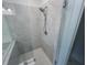 Modern bathroom shower with glass door and white marbled tile at 629 Silva St # 128, Cumming, GA 30040