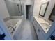 Bathroom featuring a separate tub and double vanity sink at 629 Silva St # 128, Cumming, GA 30040