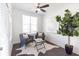 Cozy sitting room with dark wood floors, natural light, and a comfortable seating arrangement at 629 Silva St # 128, Cumming, GA 30040