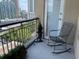 Relaxing balcony view with a metal rocking chair and a view of the city skyline at 3334 Peachtree Ne Rd # 1110, Atlanta, GA 30326