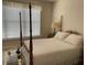 A traditionally decorated bedroom with a four-poster bed, lots of light, and calm ambiance at 3334 Peachtree Ne Rd # 1110, Atlanta, GA 30326